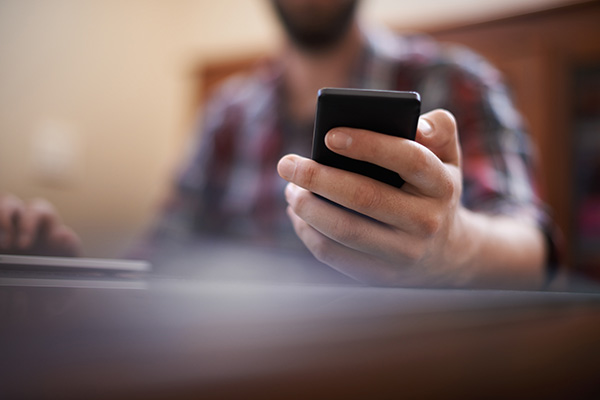 image of patient holding a phone